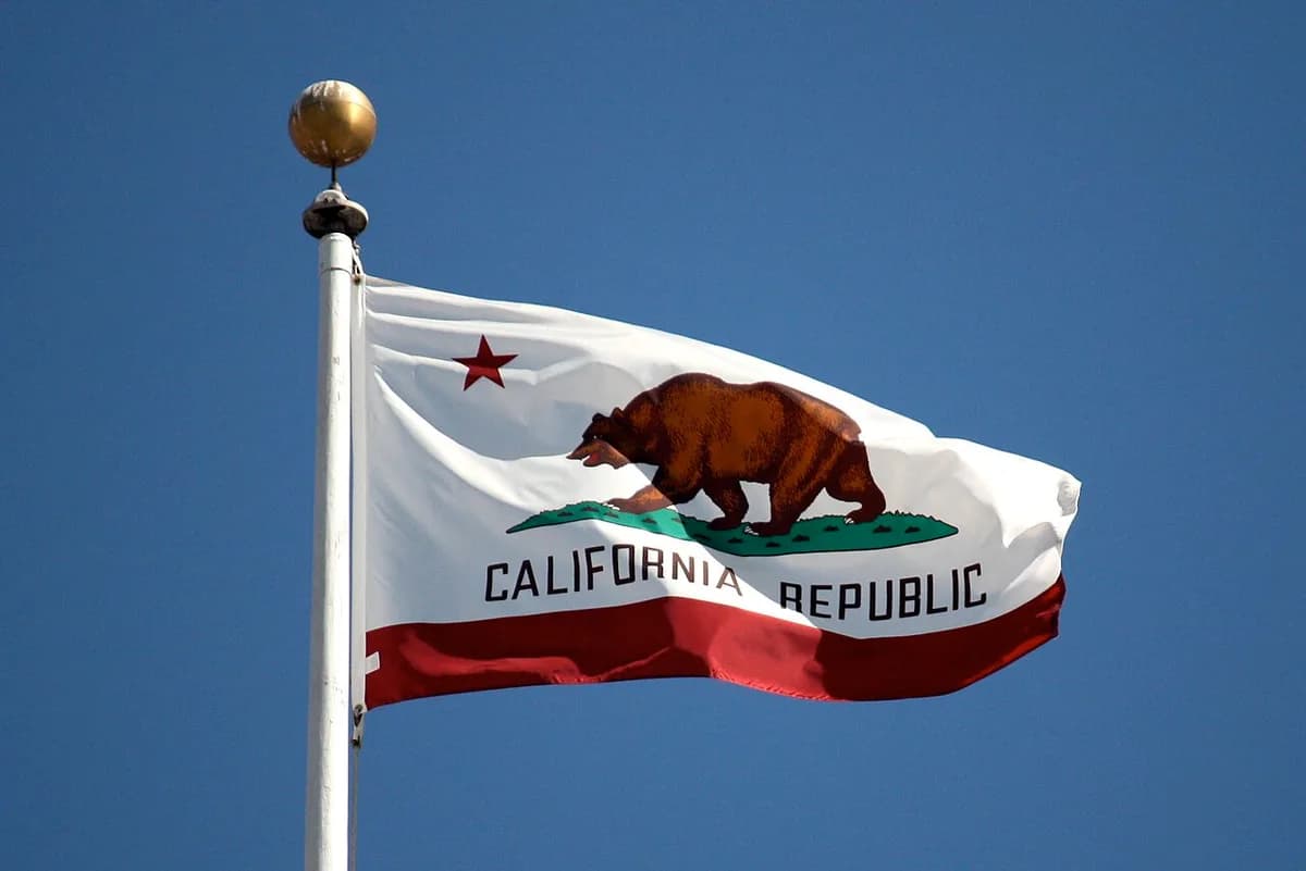 California state flag flying against a blue sky