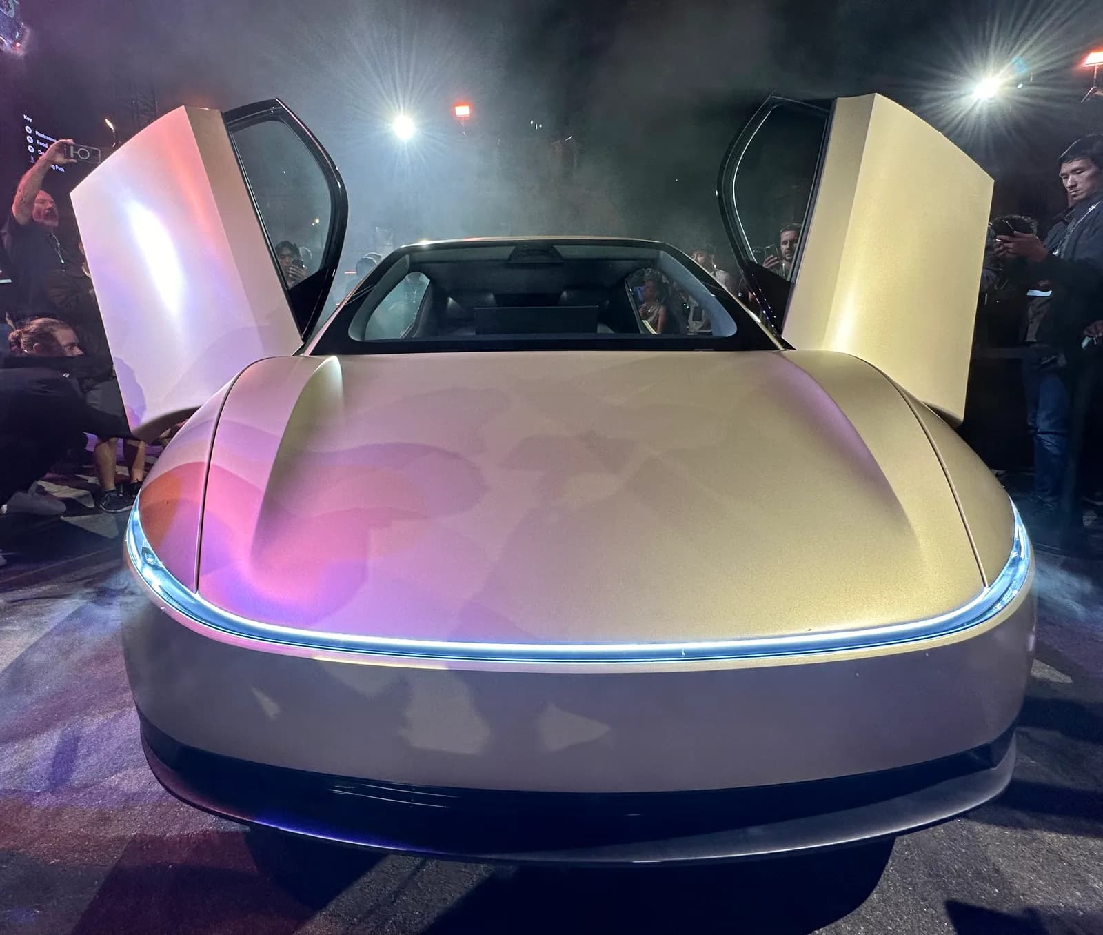 Front view of Tesla Cybercab with butterfly doors open at its unveil event