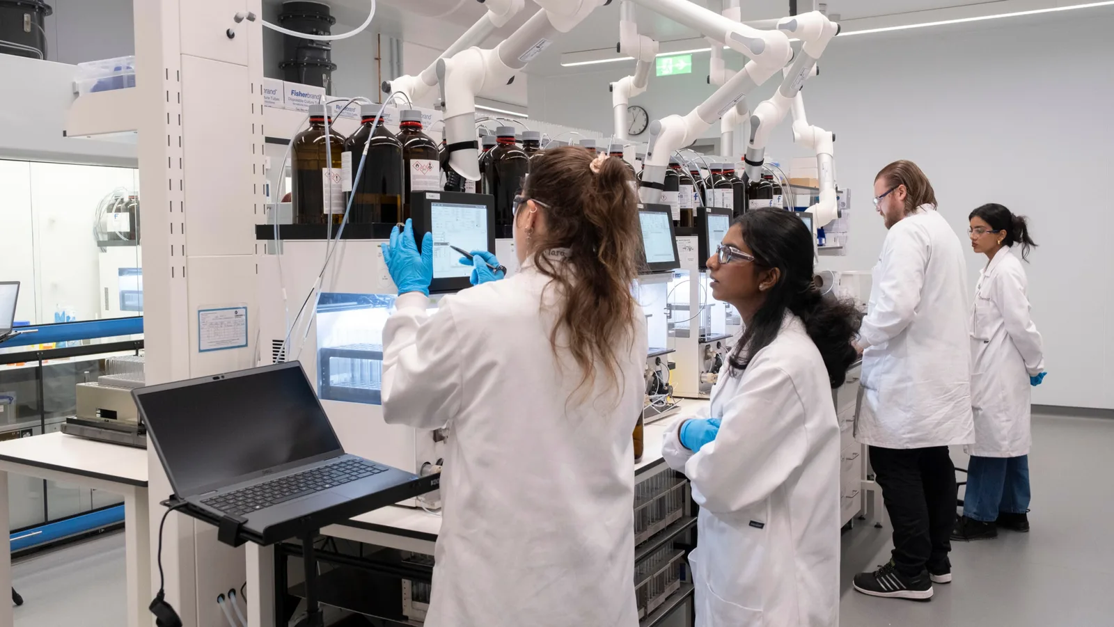 Scientists at Chemify’s Chemifarm laboratory in Glasgow working with automated chemistry equipment