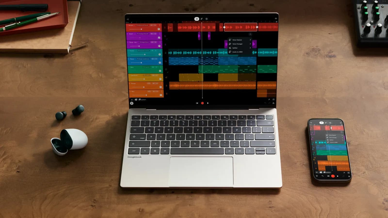 A Googlebook laptop and an Android phone side by side on a wooden desk, both showing a music production app.