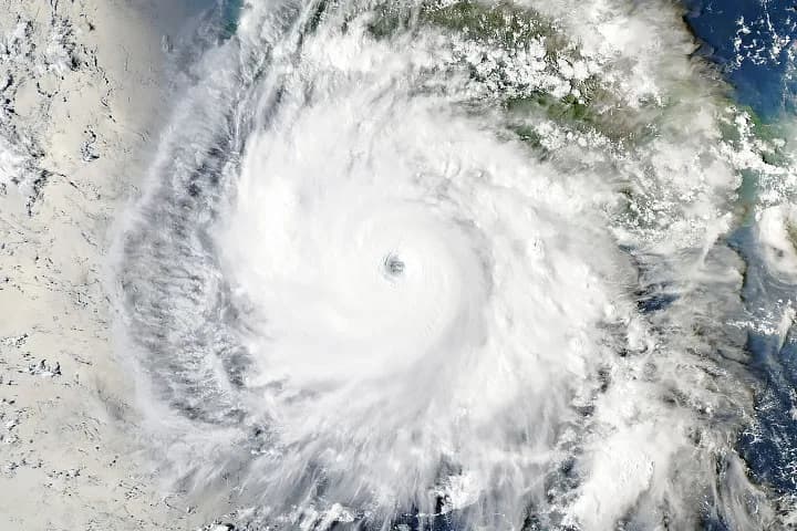 NASA satellite view of Hurricane Polo's eye and cloud bands off Mexico's Pacific coast.