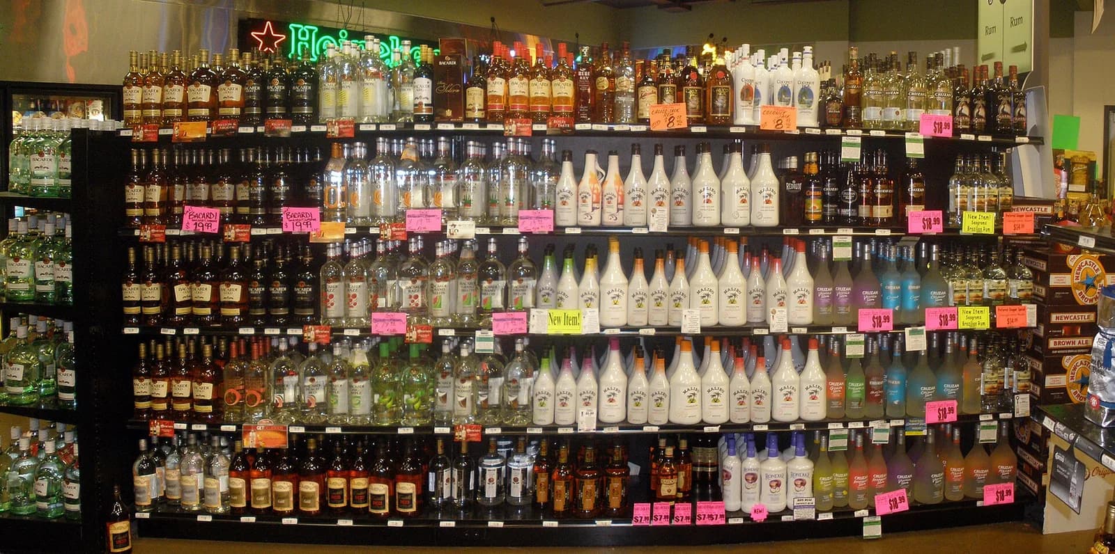 Bottles of rum on display shelves in a liquor store