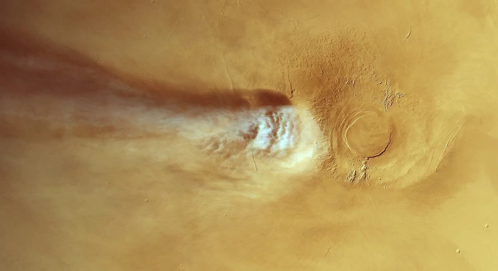Mars Express view of a long white cloud stretching across the Martian surface near Arsia Mons