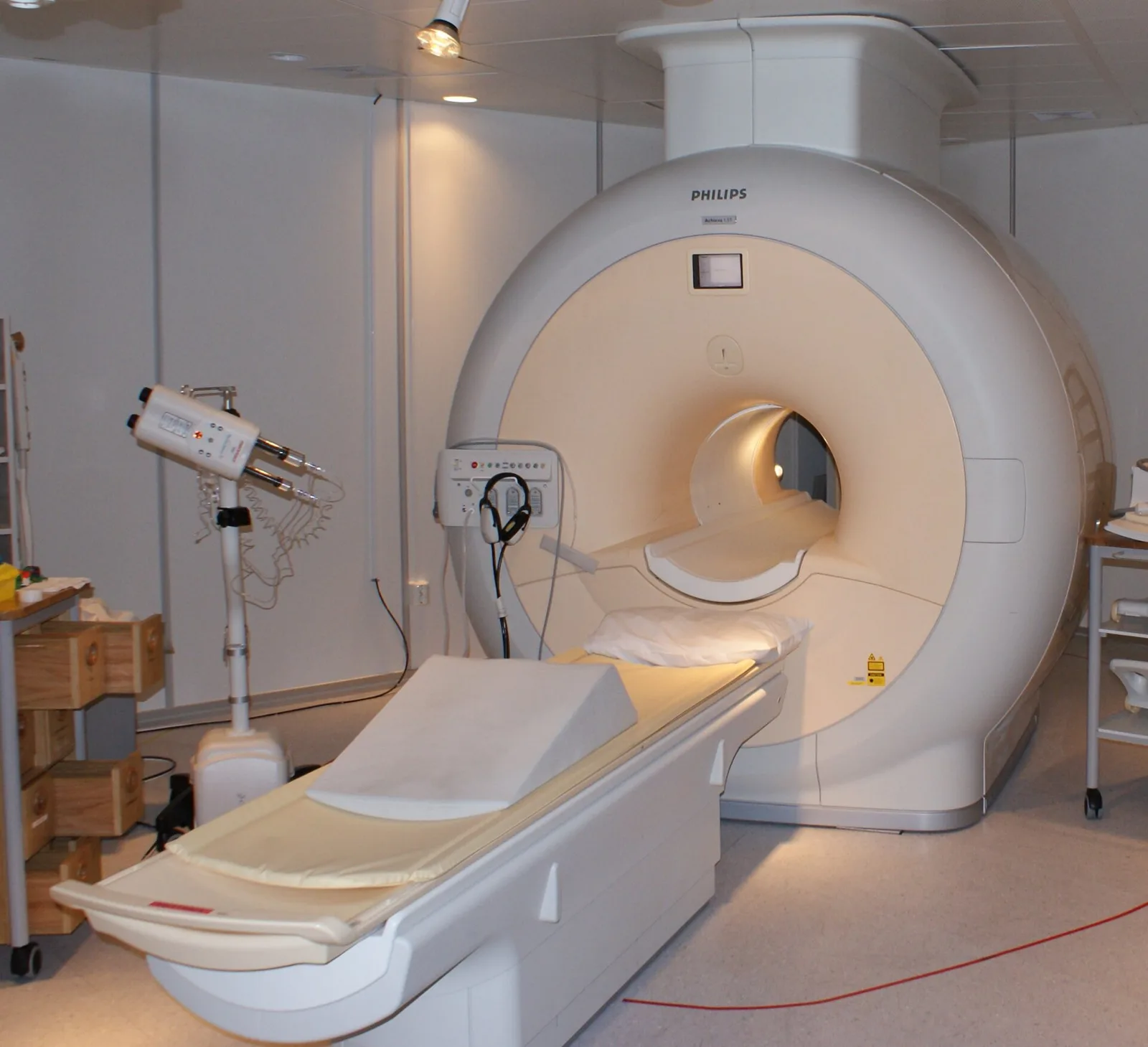 An MRI scanner with its patient table in a hospital room