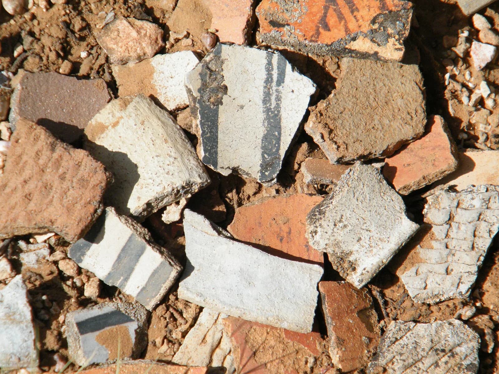 Fragments of painted pottery lying on the ground